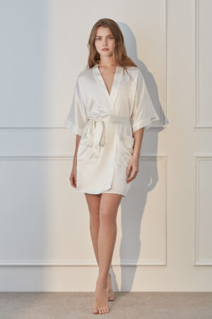 Woman in a Wedding Whisper Silk Short Kimono with elegant wide sleeves and waist tie detail.