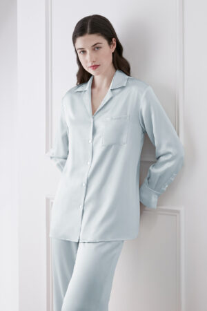 Model in Blue Resort Women's Pajama Set featuring button-up lapel shirt with relaxed fit and soft silk fabric.