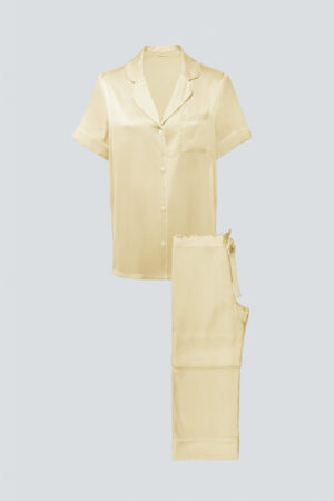 Flat lay of lemon yellow MANITO Authentic Short Sleeve Pajama Set with button-up top and drawstring pants.