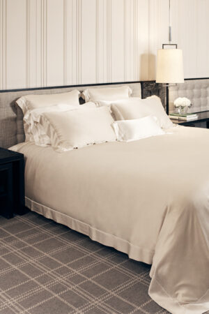 MANITO Authentic Silk Duvet Cover in champagne shade color showcased on a bed with matching pillowcases.