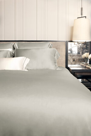 MANITO Authentic Silk Duvet Cover in quartz grey showcased in a sophisticated bedroom setting.