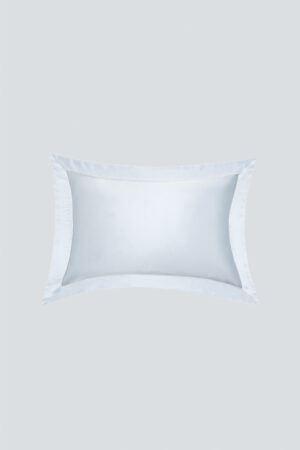 Light blue MANITO Authentic Silk Pillowcase Set laid flat to show elegant color and lustrous silk surface.