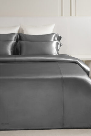 MANITO Classic Soft Light Bedding Set in gray, styled with contrasting furniture for a contemporary look.