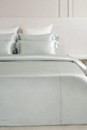 MANITO Classic Soft Light Bedding Set in soft blue, showcasing luxurious silk duvet and matching pillowcases.