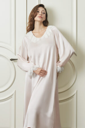 Woman wears pink Court Women's Nightdress in pink, showing double-layer lace V-neck and puff sleeves for a dreamy feel.