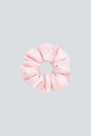 Donuts Large Silk Scrunchie in pink with donut-like volume, ideal for tying damp hair to dry into relaxed waves.