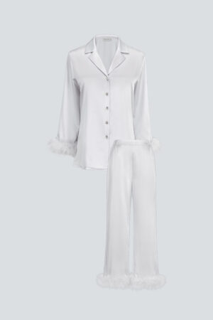 Flat lay of MANITO Diva Feather Trimmed Pajama Set in pearl white, featuring long sleeves and fluffy trims.