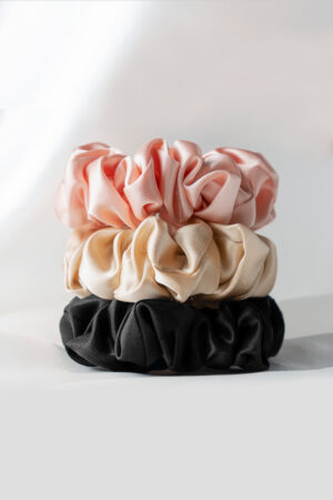 3 Pack Large Silk Scrunchie Set featuring pink, champagne, and black, crafted from soft silk for effortless elegance.