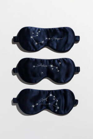 Three Stellar Zodiac Silk Eye Masks with Scorpio, Aries, and Virgo embroidery on navy silk.