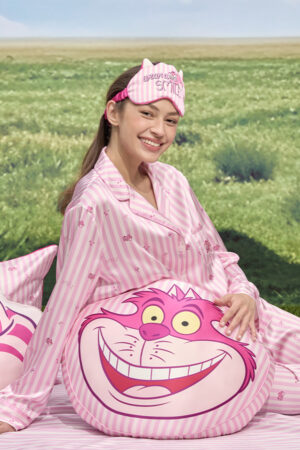 Model wearing matching eye mask and pajamas with round MANITO DISNEY Cheshire Collection Smile Face Silk Pillow.