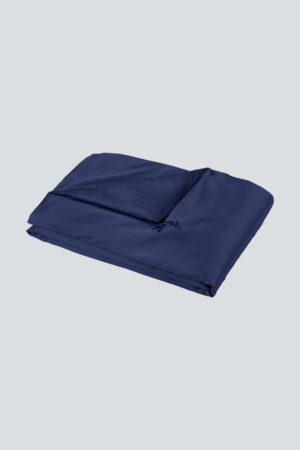 Navy blue Silk Throw Blanket folded neatly with a soft satin finish