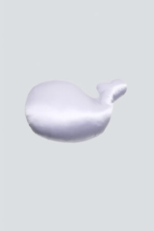 Top-down view of MANITO whale pillow, showing the smooth silk fabric and stitching quality.