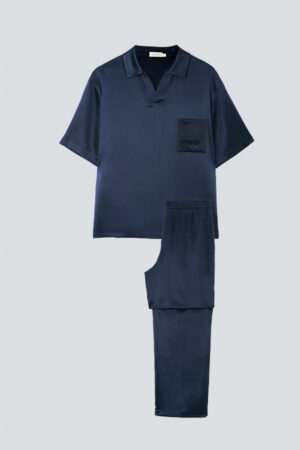 Flat lay of the navy MANITO Remington Men's Short Sleeve Pajama Set, displaying its luxurious silk fabric and modern silhouette.