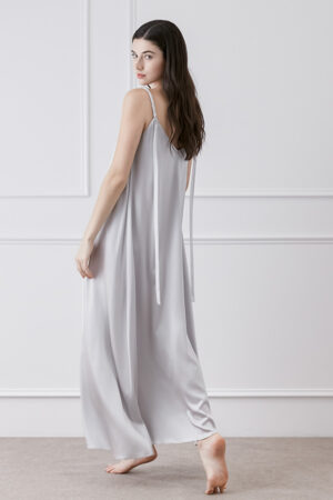 Back view of model in Serene Silk Long Dress in Nimbus Cloud, revealing flowing ribbon.