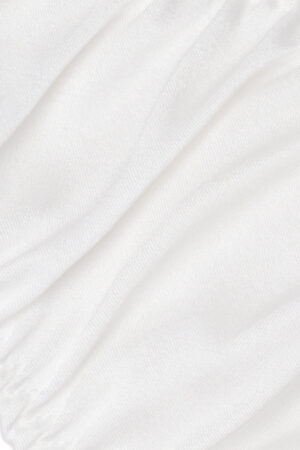 Close-up of Tacetto silk brief in white, highlighting the smooth, lustrous texture and refined stitching details.