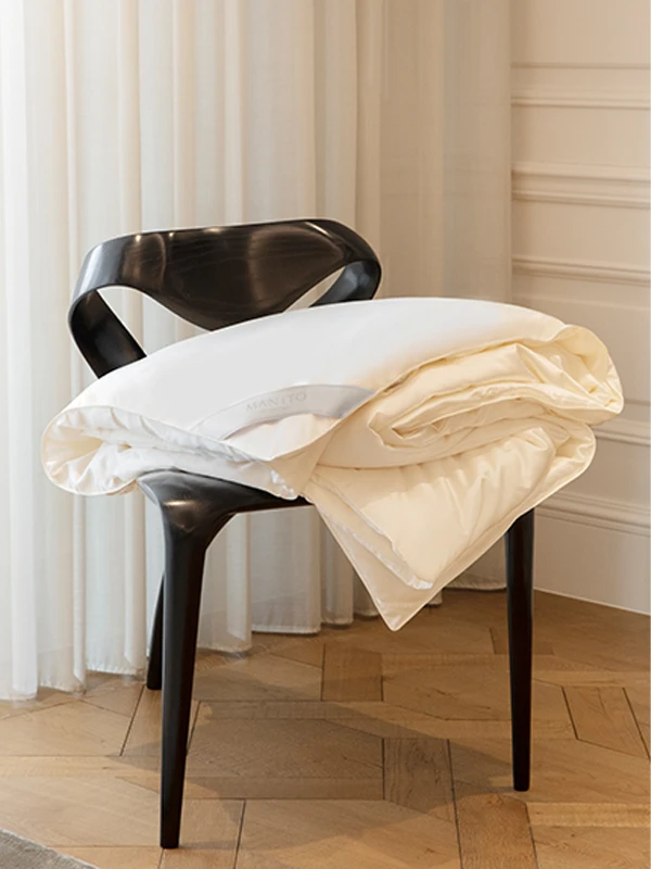 MANITO's silk duvet insert, providing warmth and comfort with high-quality silk filling.